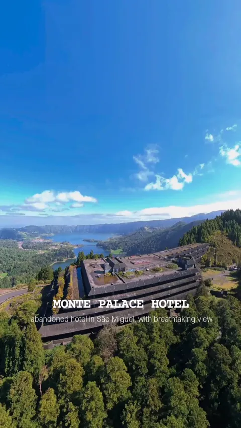 Aerial view of the abandoned Monte Palace Hotel standing above the Sete Cidades lake, São Miguel, Azores