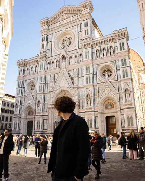 Kristi Leka walking in front of the Duomo of Santa Maria del Fiore, Florence, Italy